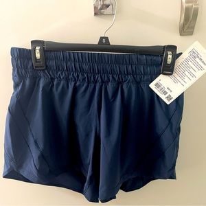 Lululemon Track That shorts with tag. Size 6. Length 5”. Navy blue.